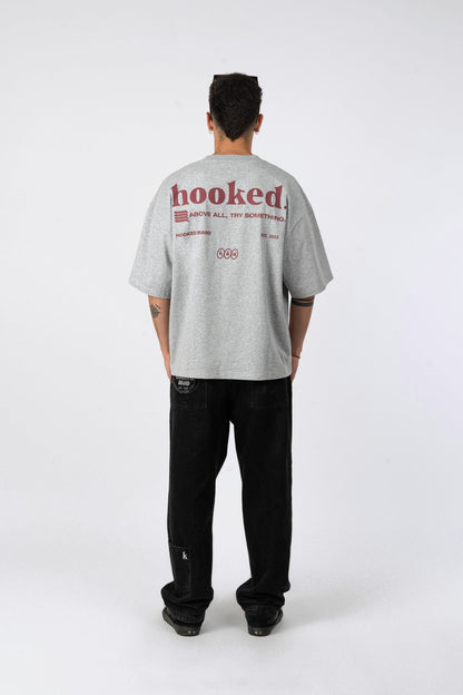 Polera oversize Hooked gris melange